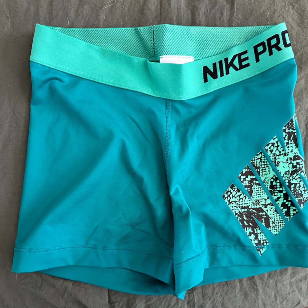 Nike Pro spandex shorts. Aqua with mint green around the band.  Size small.